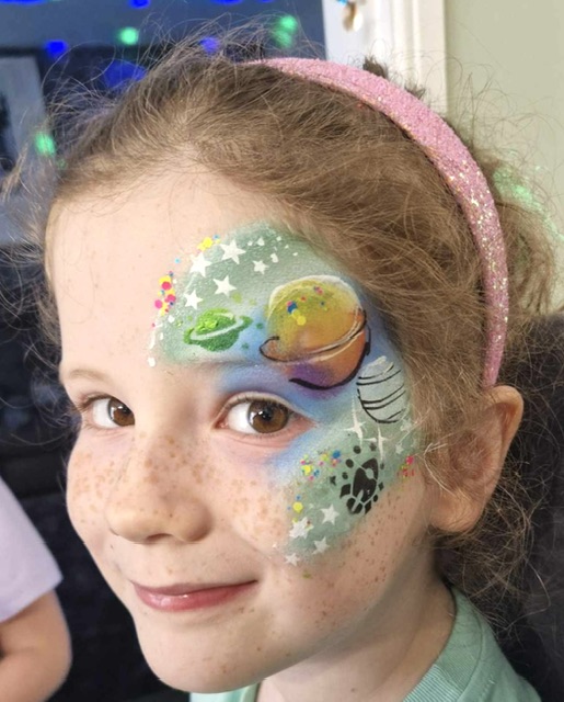 Girl with a galaxy face poaint in Telford
